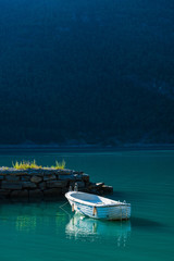 Lonely white boat in fjord