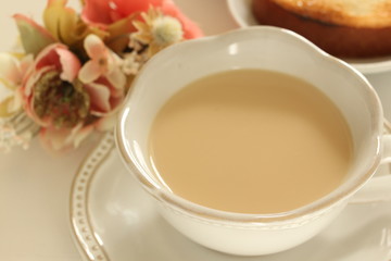 tea cup and flower on white background