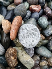 wet sea stones small  rocks natural background  seascape vacation concept wallpaper texture close up selective focus