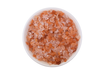 Himalayan pink rock salt in bowl isolated on white background, top view