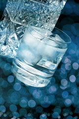 Crystal whiskey glass and bottle