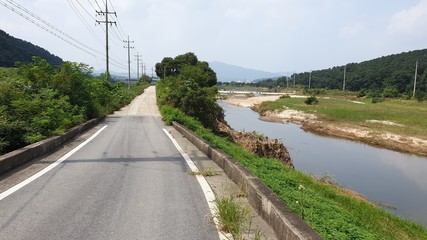 Korean country road and flowing river