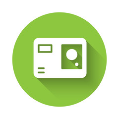 White Action extreme camera icon isolated with long shadow. Video camera equipment for filming extreme sports. Green circle button. Vector Illustration.