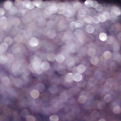 Purple violet eye shadow sparkle metallic shimmer glitter cosmetic make-up macro photo blurred...