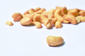 roasted salty cashew nuts arranging on white background