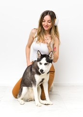 Young woman with her husky dog