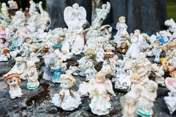 Many small toy figures of angels