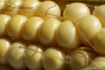 Surface of ripe grains of sweet corn. Macro photography.