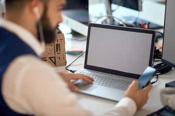 Young business man working on laptop