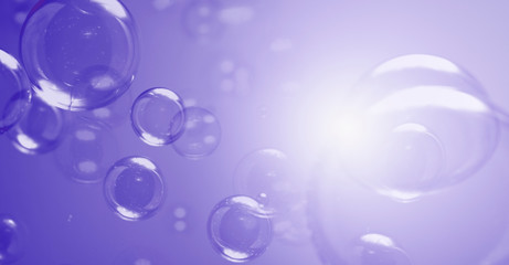 Bubbles abstract background. Transparent clear soap bubbles float on purple dark background.