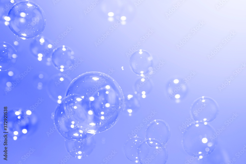Wall mural purple soap bubbles abstract background with copy space.
