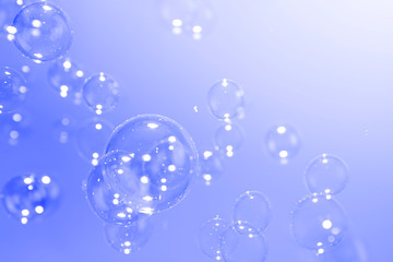 Purple soap bubbles abstract background with copy space.