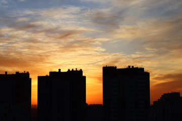 Obraz na płótnie Canvas Sunset in the big city, shadows