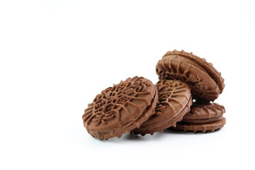 Close-Up Stack Of Chocolate Biscuits Against White Background