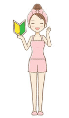 ルームウエアを着た女性が若葉マークを持ってガッツポーズをしている