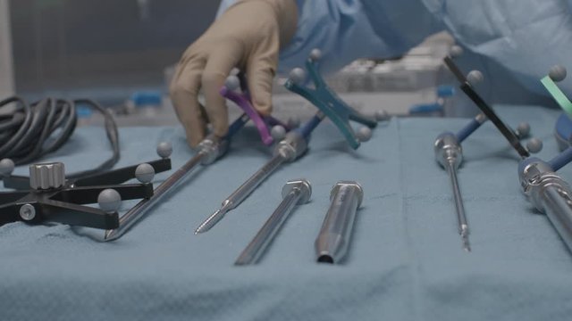 A table of medical devices are prepared for surgery. 