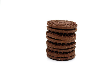 Close-Up Stack Of Chocolate Biscuits Against White Background