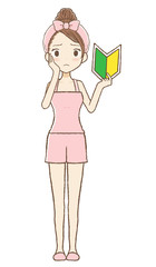 ルームウエアを着た女性が若葉マークを持って悩んでいる