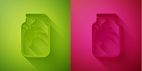 Paper cut Spider in jar icon isolated on green and pink background. Happy Halloween party. Paper art style. Vector.