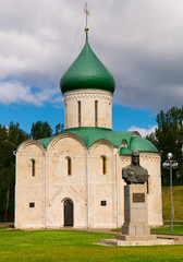 Fototapeta na wymiar View of white-stone Transfiguration Cathedral and monument to Prince Alexander Nevsky in Pereslavl Kremlin, Pereslavl-Zalessky, Russia