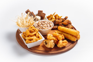 Isolated beer platter with chicken onion rings