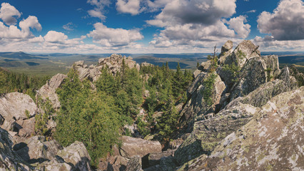 Fototapeta na wymiar Panoramic landscape of rocky range in wild mountains. National park scenery