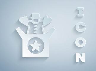 Paper cut Jack in the box toy icon isolated on grey background. Jester out of the box. Paper art style. Vector.
