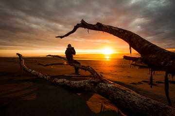 photographer and beautiful sunset sky