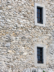 Fototapeta na wymiar Two windows in an old stone wall, Bobolice castle, Poland