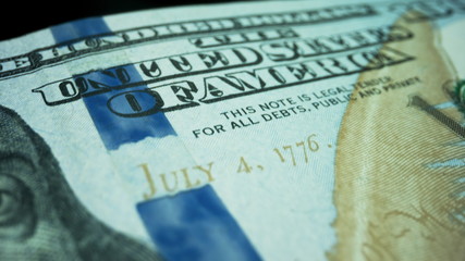 Fototapeta premium Cash money background. New one hundred dollar banknote on black background