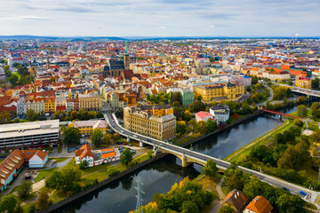 Picturesque aerial view of old buildings of Pilsen cityscape with river and ponds, Czech Republic