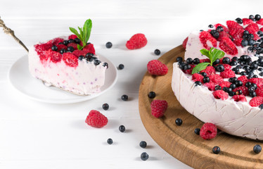 Beautiful white cream cheese cake with different summer berries