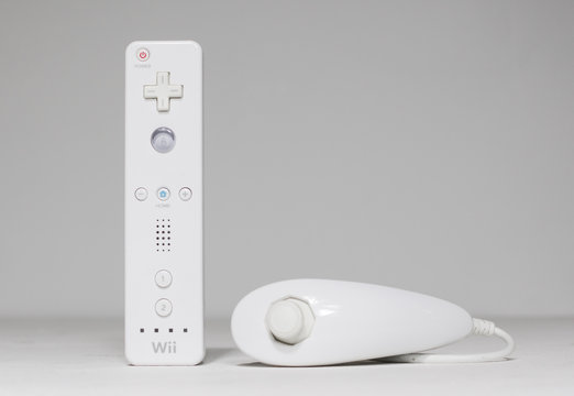 london, UK 05/052019 Nintendo wii Controller and nunchuk on a white isolated background. iconic retro vintage video gaming controller machine.
