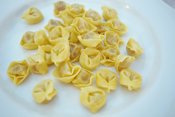 Italian traditional tortellini pasta over white plate. Healthy diet. Mediterranean cuisine.