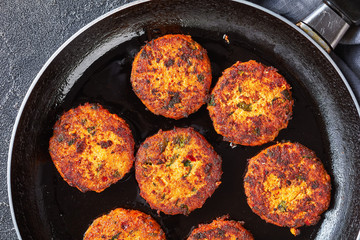 fried thai fish cakes on a skillet