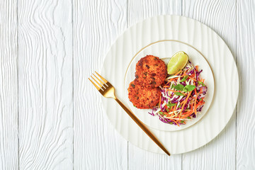 fried thai fish cakes with salad on a plate