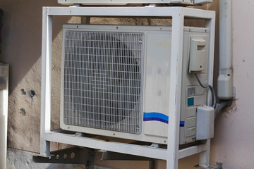 Crack cover of air condenser unit. Condenser air conditioner has dust.