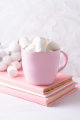 Fototapeta na wymiar Cup of hot chocolate with marshmallows on a white background.Side view.