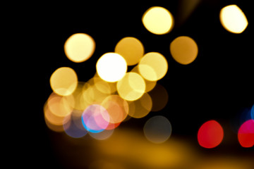 Bokeh light of street lamps at night with blurred background.