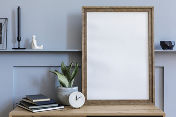 Modern scandinavian home interior with mock up poster frame, design wooden commode, candlestick,...