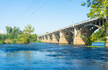 Fototapeta na wymiar Long bridge for cars and trucks over major riverway in Columbia, South Carolina