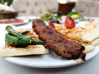 delicious Adana kebab and salads