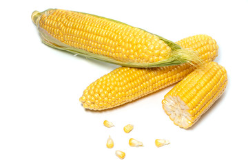 The peeled ear of corn, a piece of and seeds on a white, isolated