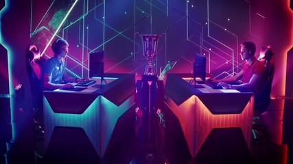 Two Professional Competitive Esport Gamers Compete in a Video Game Playing on a Championship Event. Blue Team Celebrate Victory against Red. Online Streaming Cyber Tournament. Static Shot