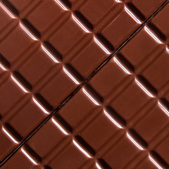 Pure chocolate bars, looking especially delicious. they are squared blocks shaped