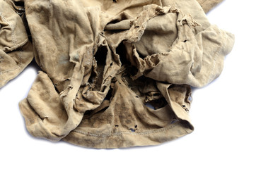 Old dirty torn rag isolated on white background. Cleaning rag.
