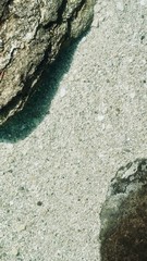 Abstract Beige and Brown Rocks Under Clear-Green Natural Spring