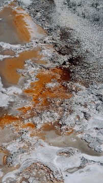 Abstract Orange and White Natural Spring with Dark Gray Rocks