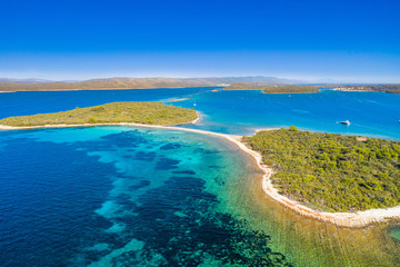 Amazing exotic islands with natural bridge in turquoise sea on the island of Dugi Otok in Croatia, drone aerial view, Adriatic sea paradise
