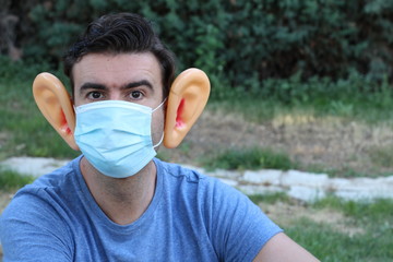 Exhausted looking man presenting ear discomfort 
